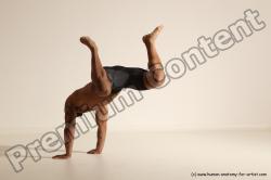 Underwear Gymnastic poses Man Black Muscular Bald Dancing Dynamic poses Academic